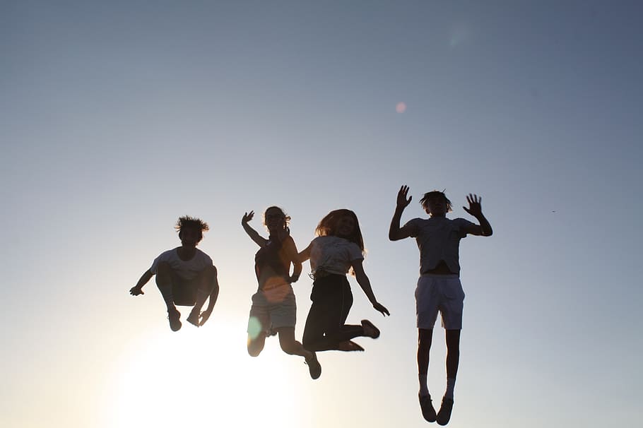 JSED_Students jumping on the beach
