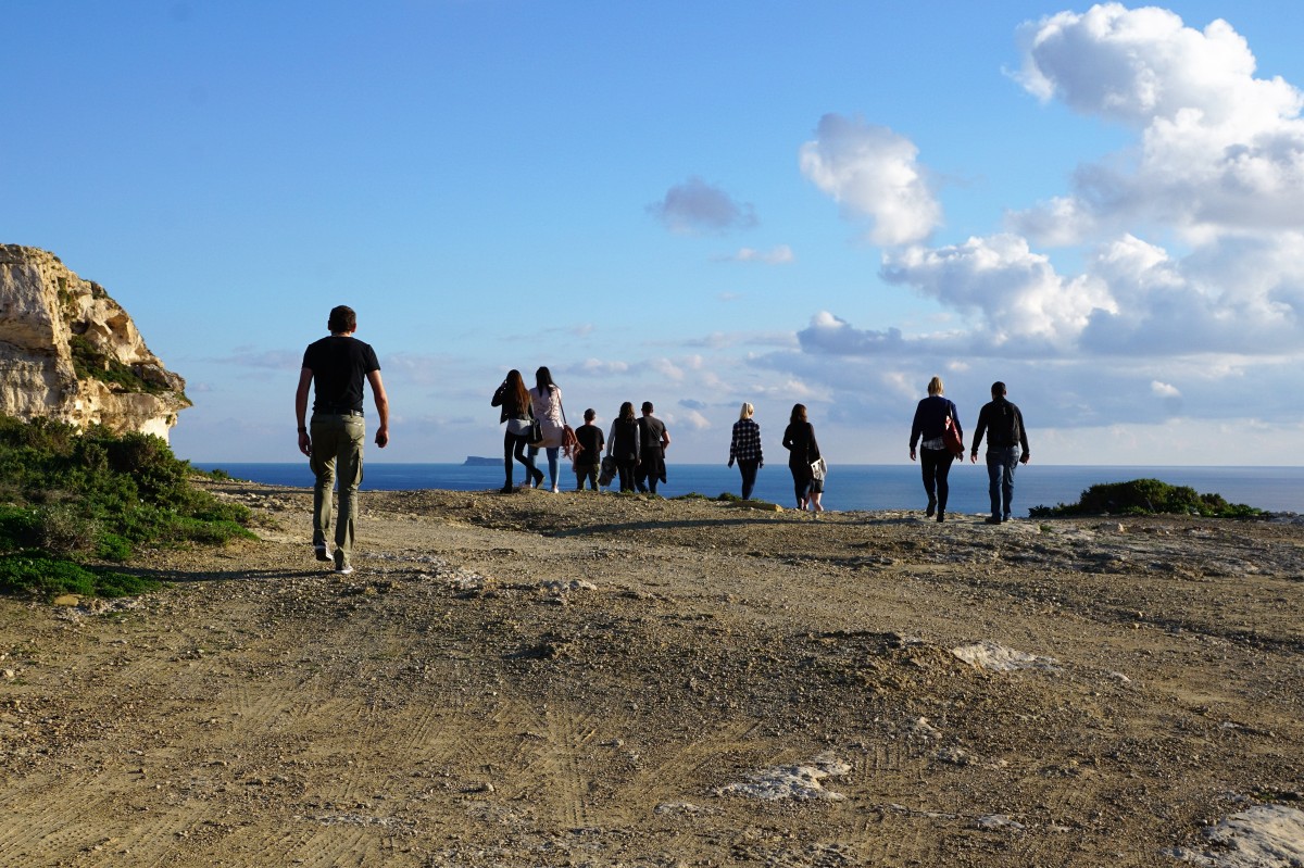 Students hiking along the coast line 